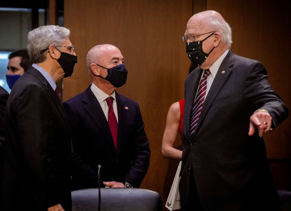 PHOTO: Attorney General Merrick Garland and Homeland Security Secretary Alejandro Mayorkas chat with Sen. Patrick Leahy before the Senate Appropriations committee hearing to examine domestic violent extremism, on May 12, 2021, in Washington.