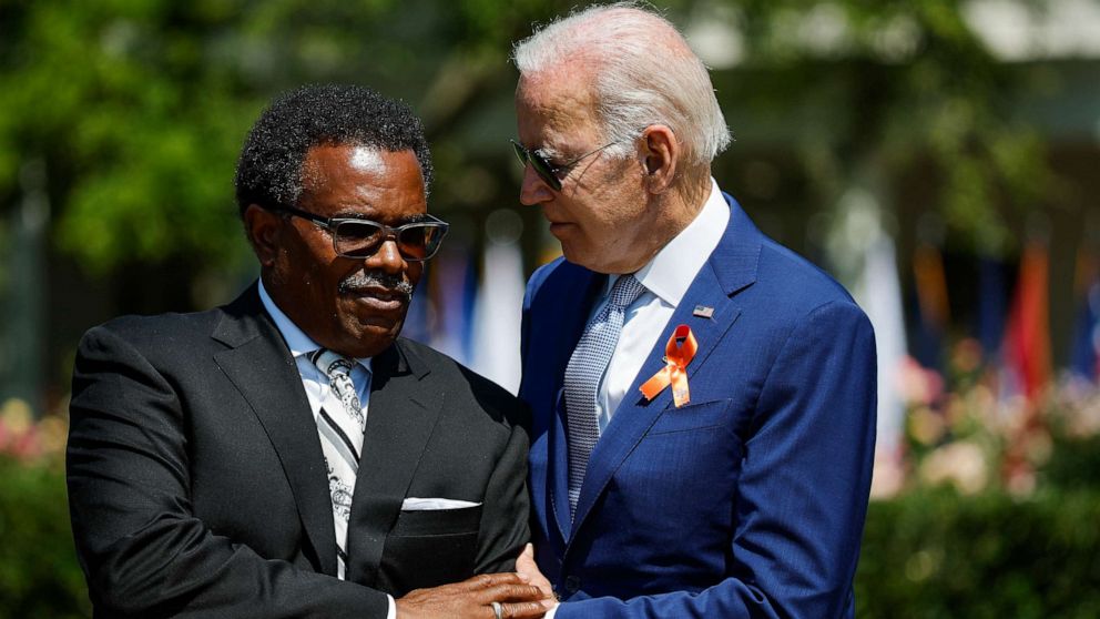 PHOTO: President Joe Biden embraces Garnell Whitfield Jr., the son of Ruth Whitfield who was killed in a mass shooting in Buffalo, NY, at an event on the South Lawn of the White House, July 11, 2022, in Washington.