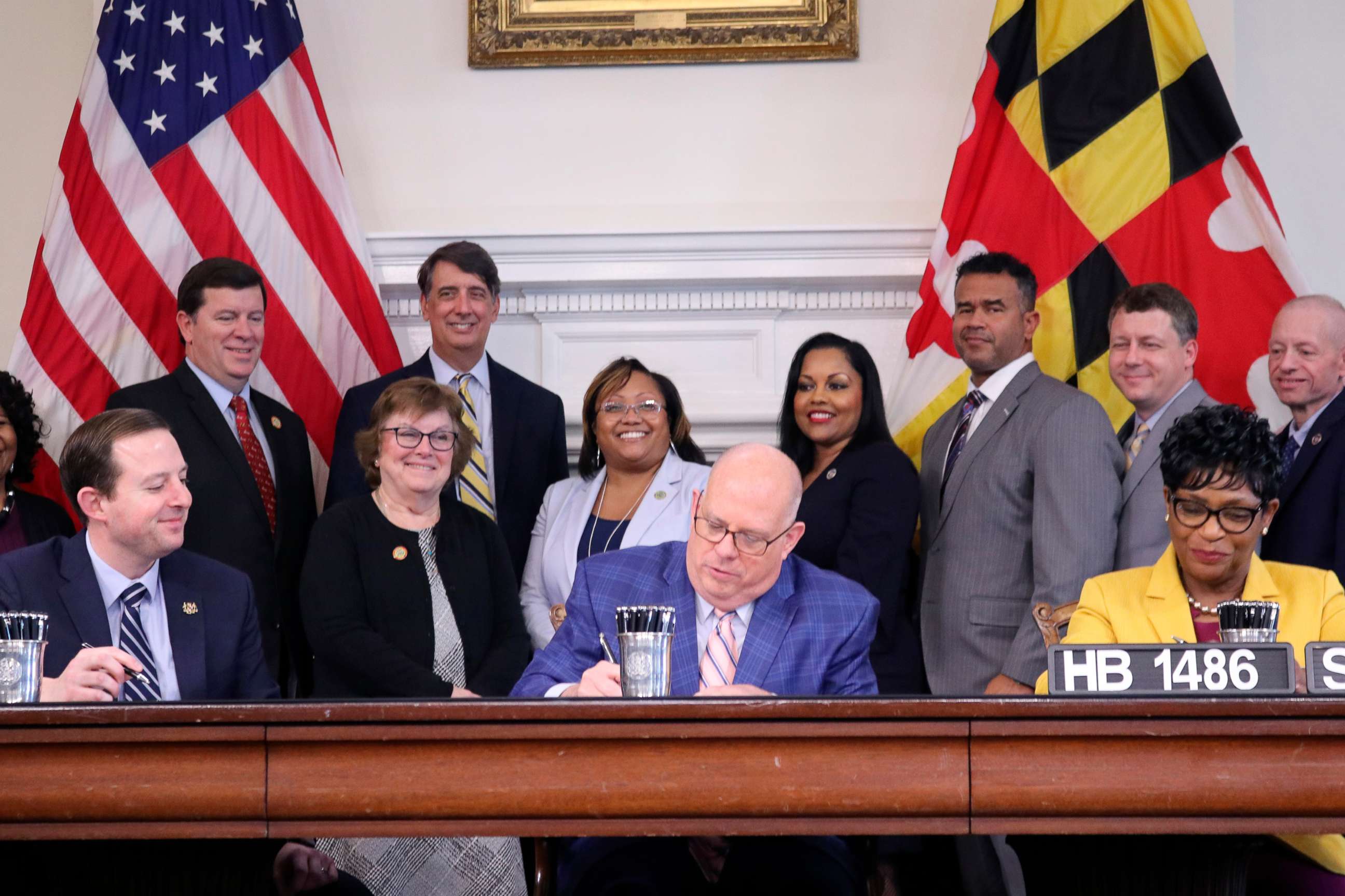 PHOTO: Maryland Gov. Larry Hogan signs a bill into law to suspend the state's gas tax for 30 days during a bill signing ceremony in Annapolis, Md., March 18, 2022.