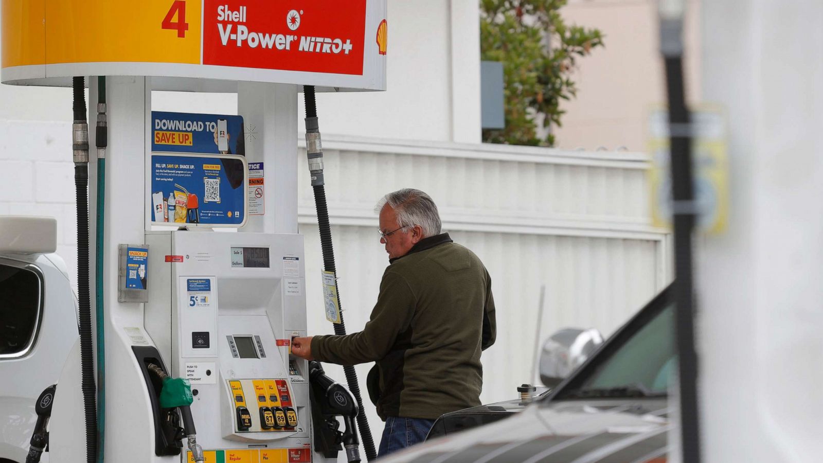 PHOTO: A customer prepares to pump gas at a Shell station, July 12, 2021, in San Francisco.