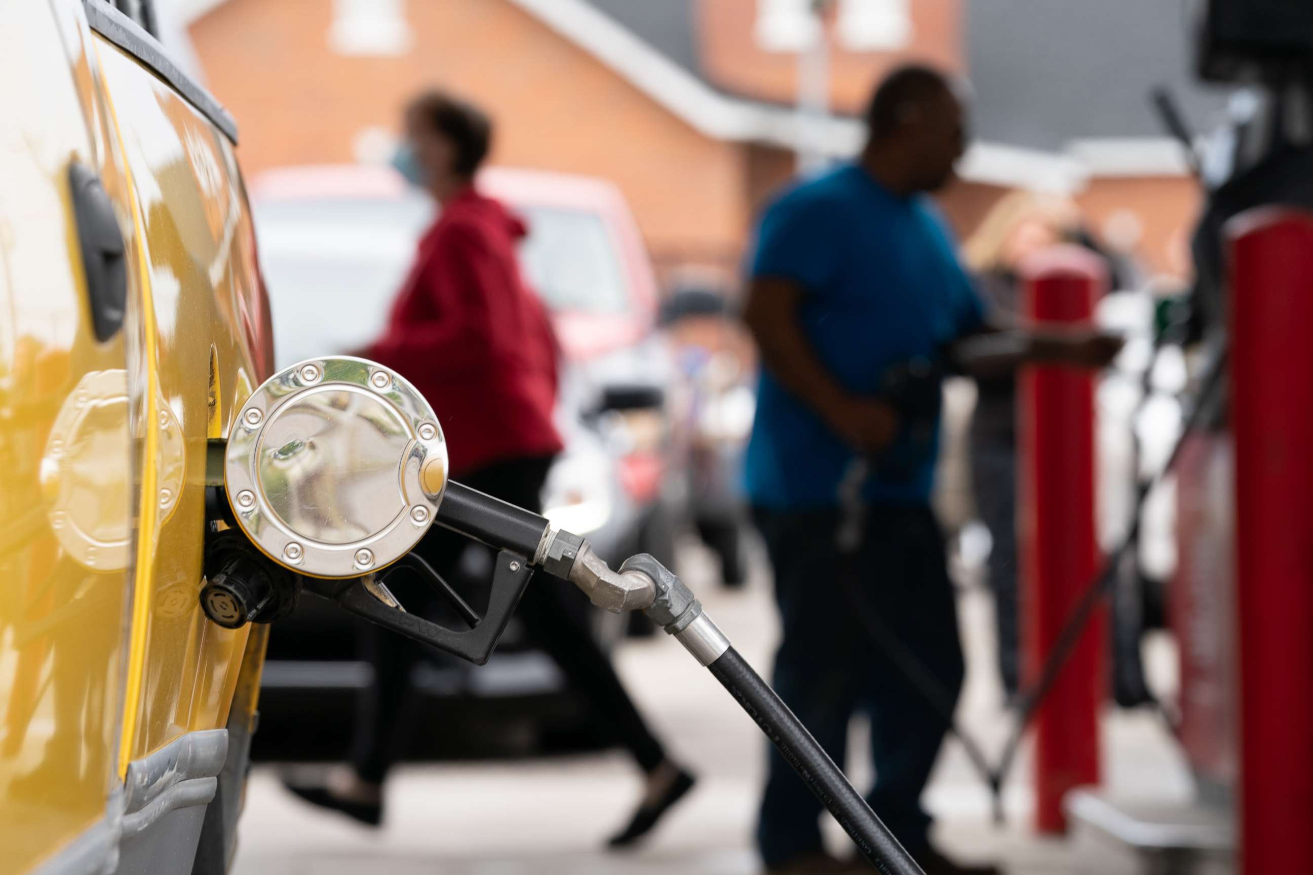 PHOTO: People refuel at a gas station on May 12, 2021, in Benson, N.C.