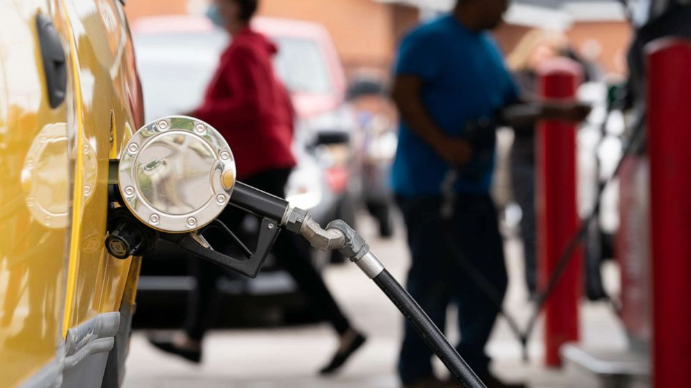 PHOTO: People refuel at a gas station on May 12, 2021, in Benson, N.C.