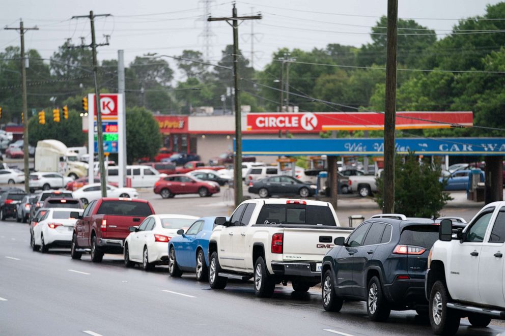 PHOTO: Motorists wait in line to refuel at a Circle K gas station on May 12, 2021, in Fayetteville, N.C.