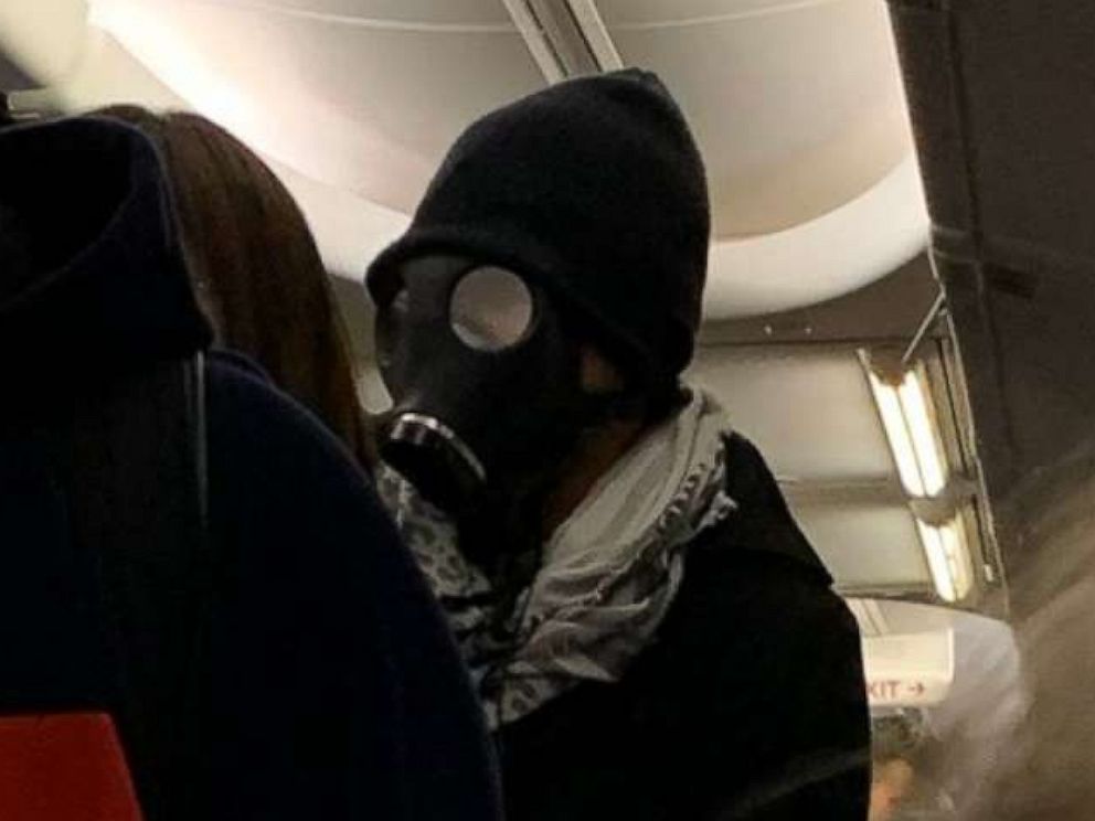Airline Removes Gas Mask Wearing Passenger After He Panics