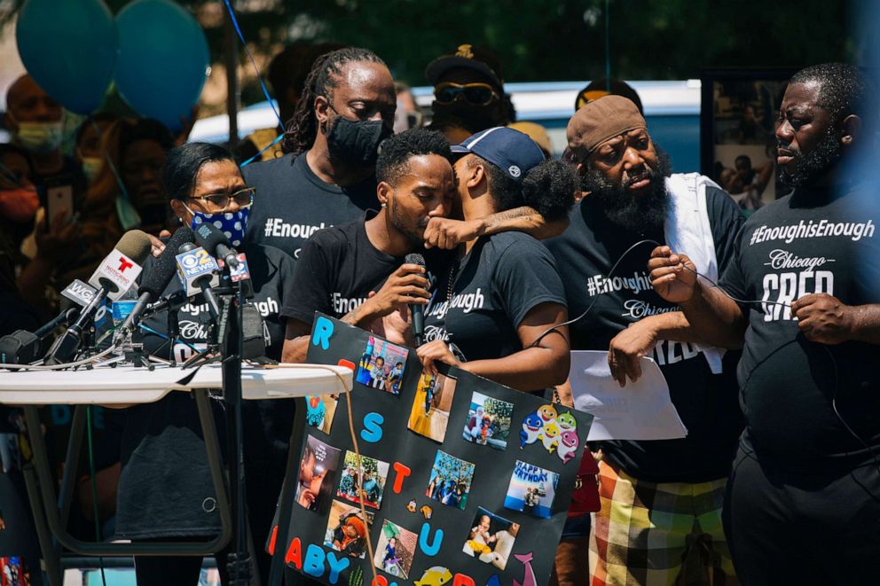 PHOTO: Thomas Gaston and Yasmin Miller, whose son Sincere Gaston was killed in a shooting on June 27, embrace at a vigil while speaking in Chicago, July 1, 2020.