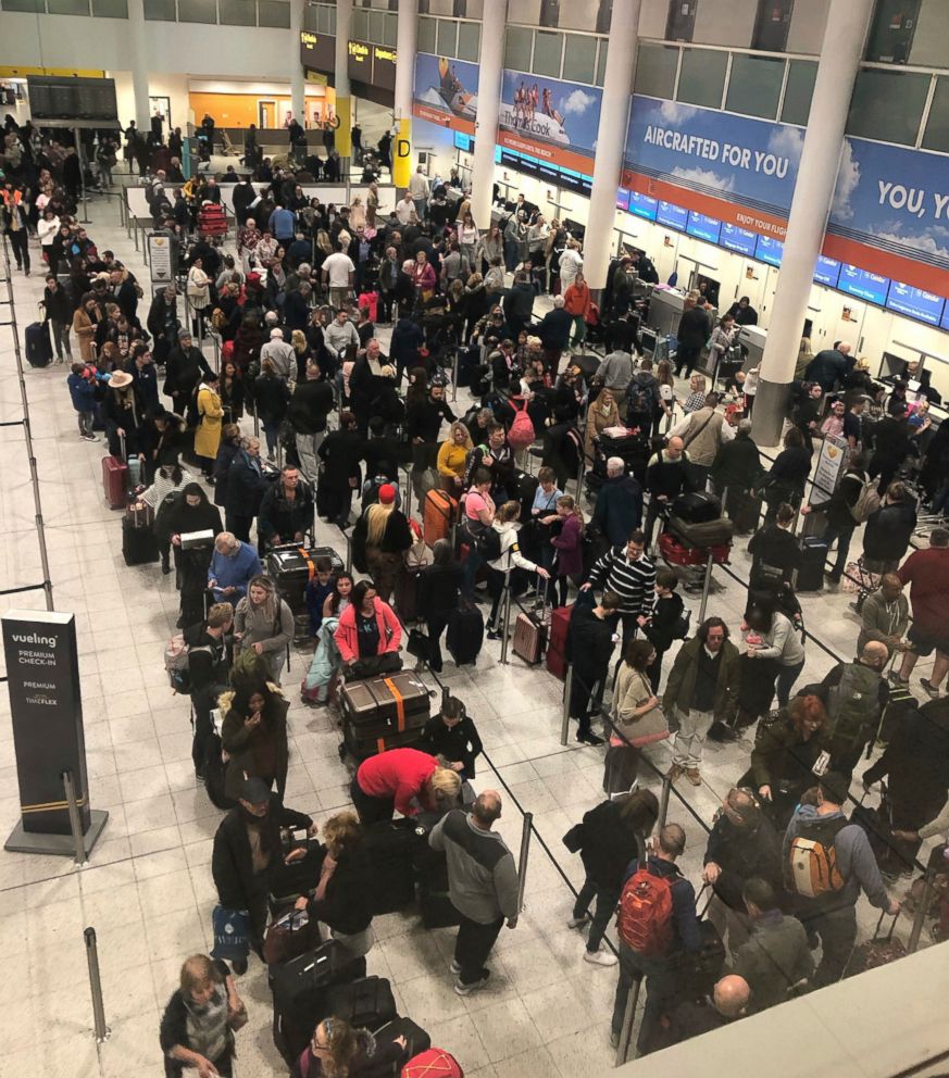 PHOTO: Queues of passengers wait at the check-in desks at Gatwick Airport, as the airport remains closed with flights delayed or diverted to other airports, after drones were spotted over the airfield last night and this morning Thursday Dec. 20, 2018.