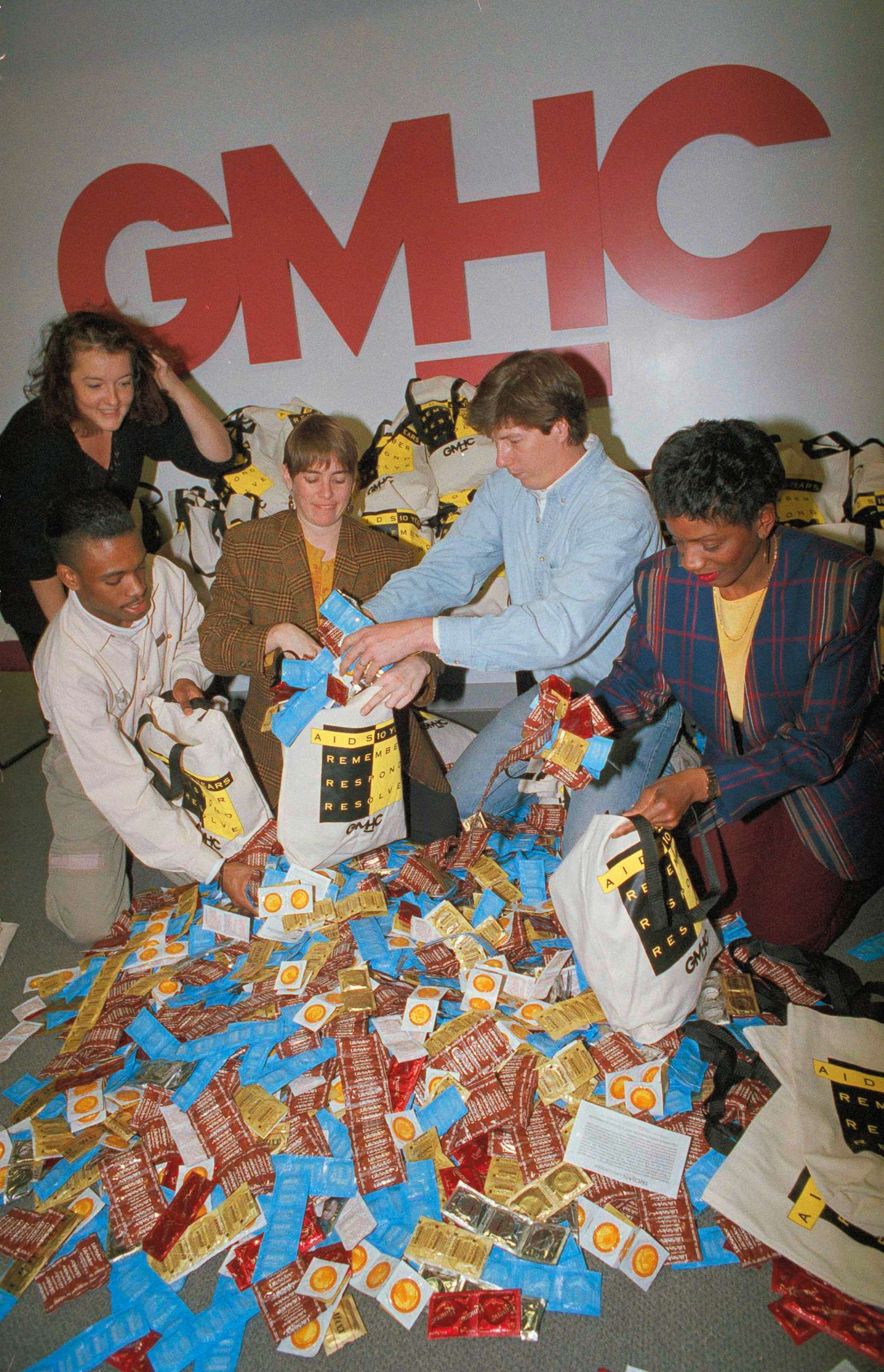 PHOTO: Volunteers at the Gay Mens' Health Crisis in New York load bags with condoms for distribution with leaflets promoting safe sex and AIDS awareness, Nov. 25, 1991.