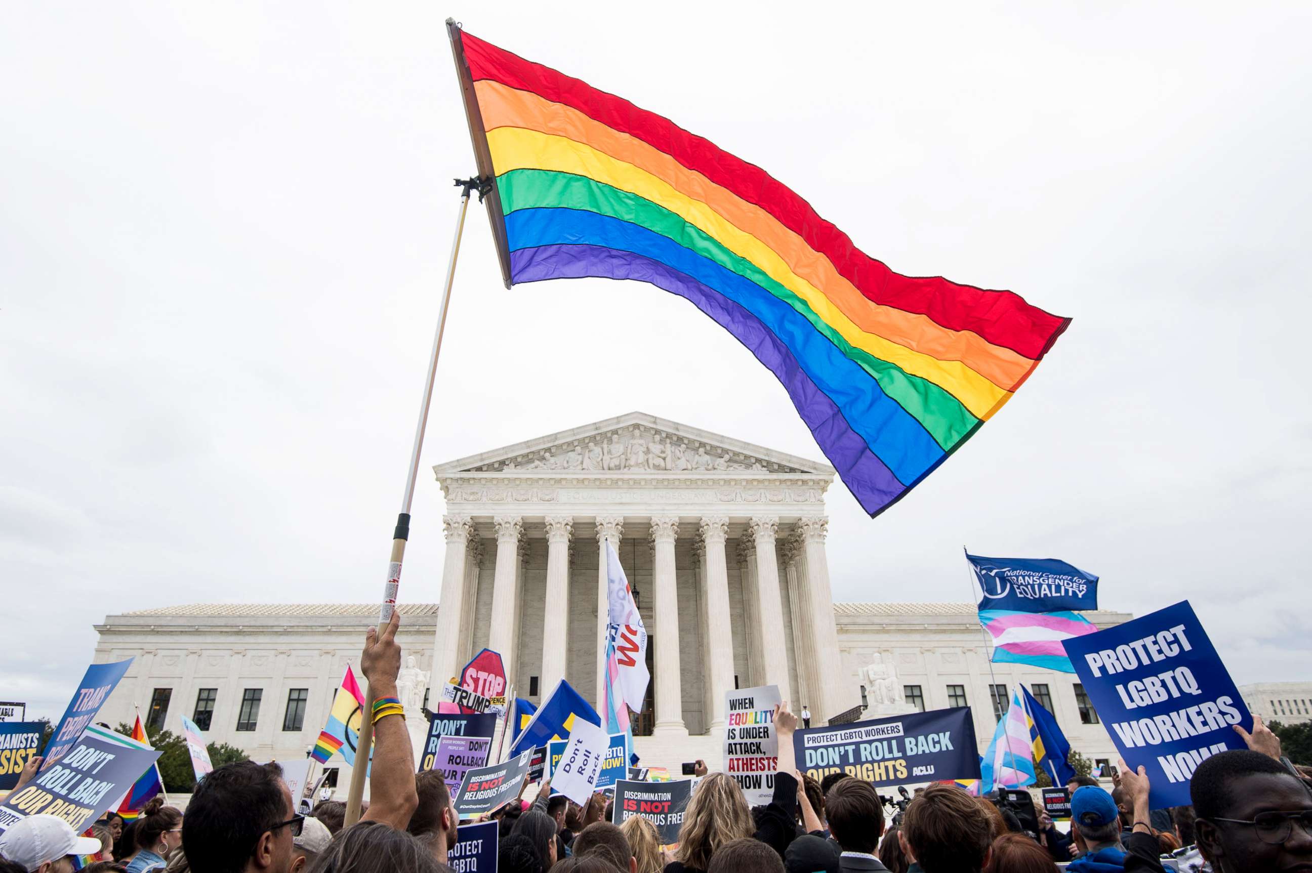 PHOTO: Protesters rally in front of the Supreme Court as it hears arguments on whether gay and transgender people are covered by a federal law barring employment discrimination on the basis of sex on Oct. 8, 2019.