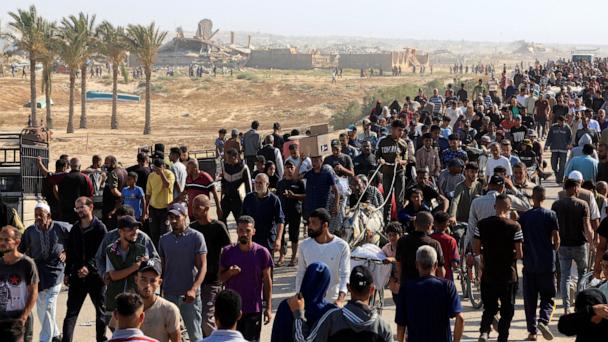 Palestinians seeking aid gather near an aid distribution site run by the U.S.-backed Gaza Humanitarian Foundation, in Rafah, in the southern Gaza Strip, May 27, 2025. 