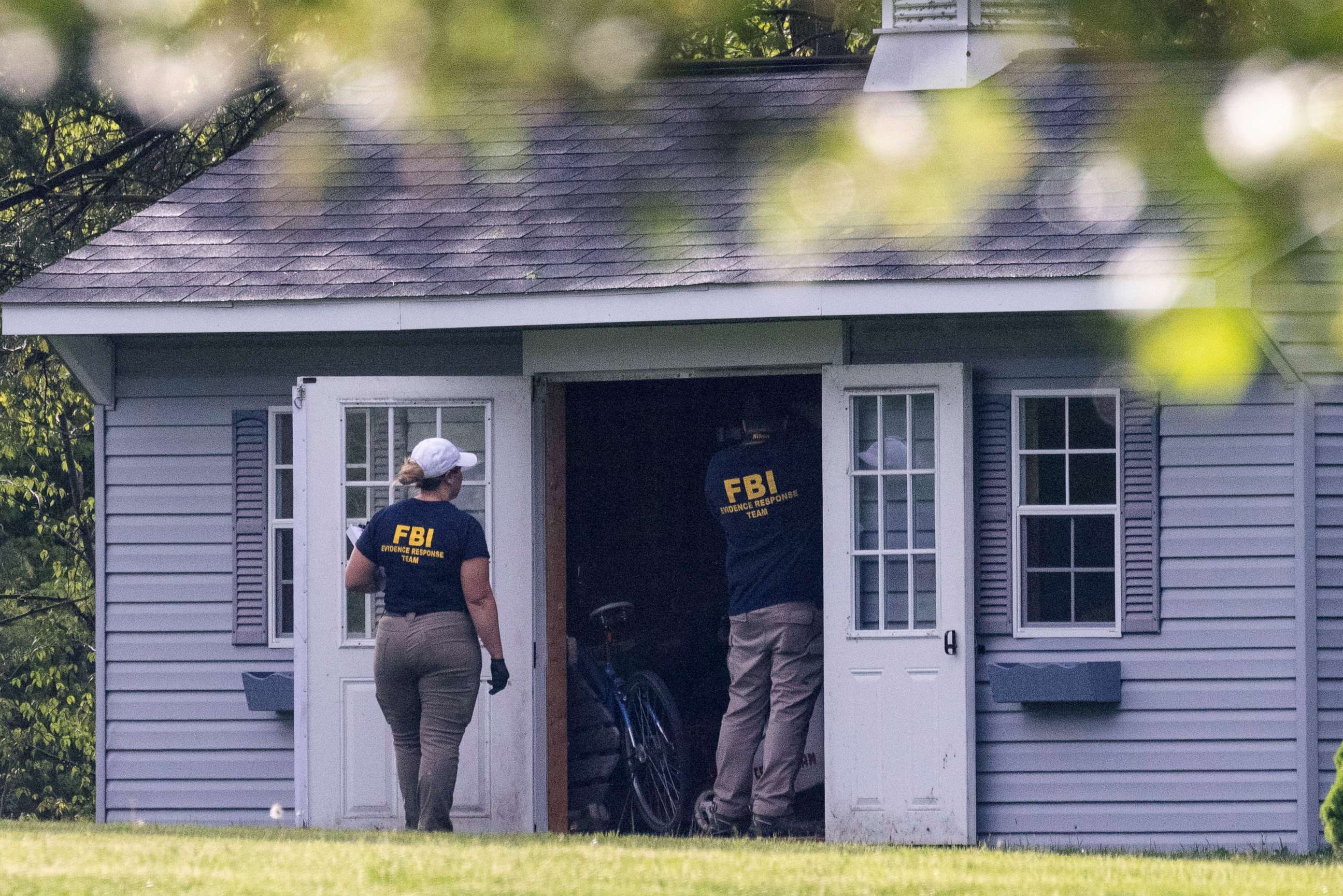 PHOTO: Law enforcement personnel search a shed at the home of Buffalo supermarket shooting suspect Payton Gendron in Conklin, New York, May 15, 2022.