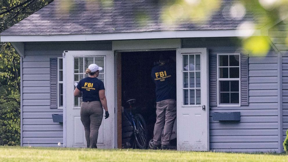 PHOTO: Law enforcement personnel search a shed at the home of Buffalo supermarket shooting suspect Payton Gendron in Conklin, New York, May 15, 2022.