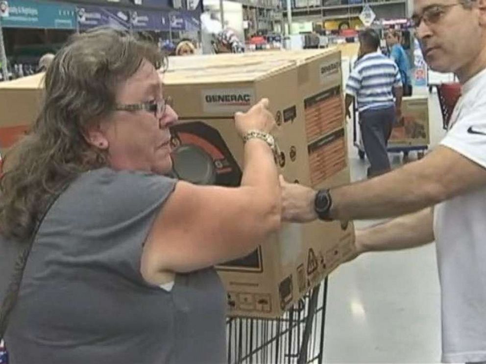 PHOTO: Pam Brekke thanks fellow Florida resident Ramon Santiago after she failed to get a generator at Lowes Home Improvement store and he gave her his.