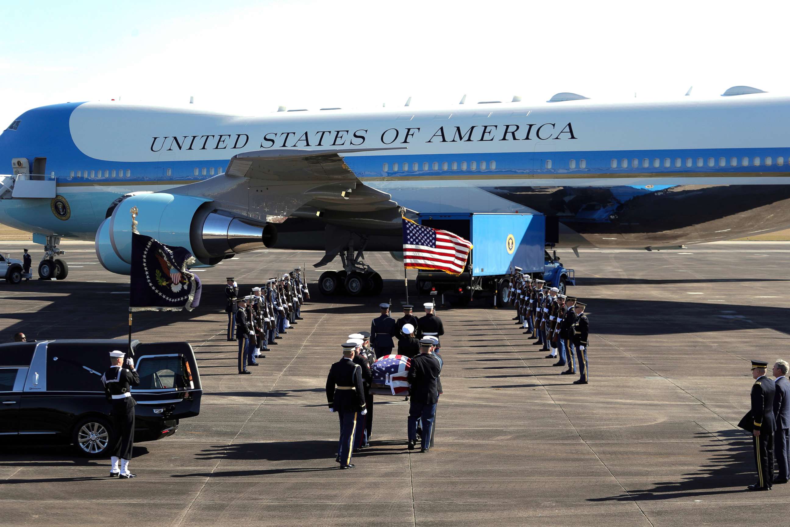 PHOTO: The flag-draped casket of former President George H.W. Bush is carried by a joint services military honor guard to Special Air Mission 41 at Ellington Field during a departure ceremony in Houston,  Dec. 3, 2018.