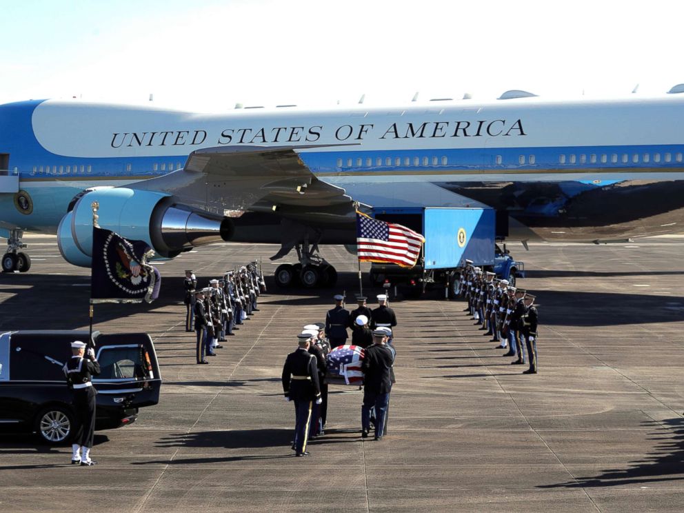 PHOTO: The flag-draped casket of former President George H.W. Bush is carried by a joint services military honor guard to Special Air Mission 41 at Ellington Field during a departure ceremony in Houston, Dec. 3, 2018.