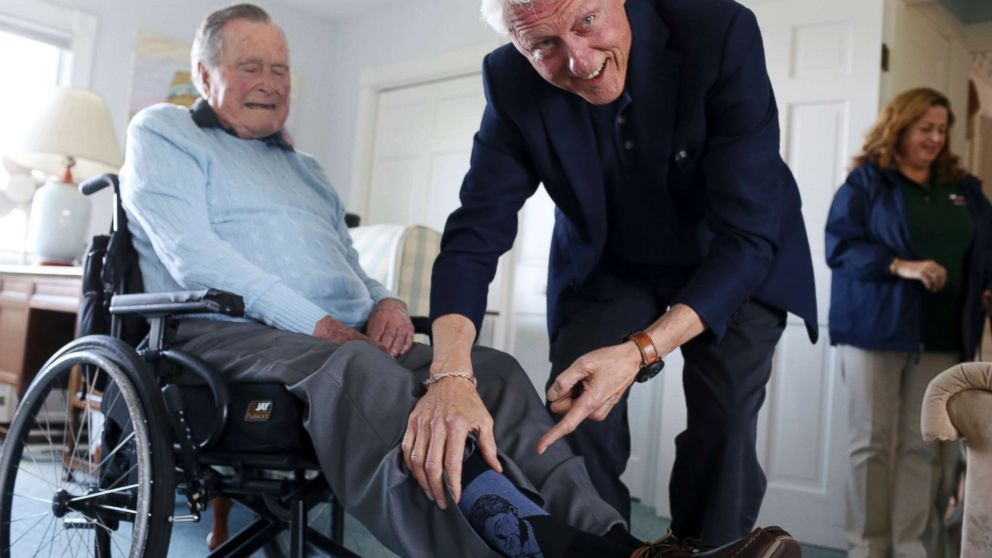 PHOTO: Former President Bill Clinton jokes with former President George H.W. Bush, as Bush shows off a pair of "Bill Clinton socks," while Clinton visits Bush at his home in Kennebunkport, Maine, June 25, 2018.