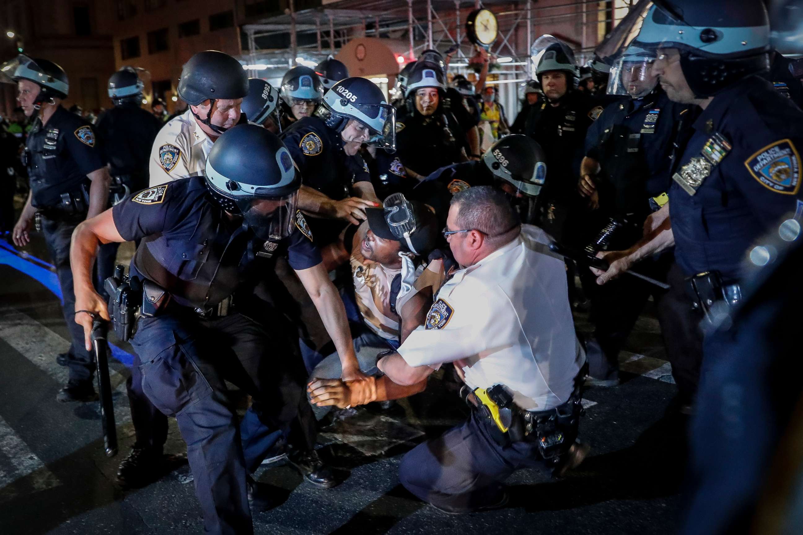 PHOTO: A protester is arrested on Fifth Avenue by NYPD officers during a march, Thursday, June 4, 2020, in the Manhattan borough of New York.