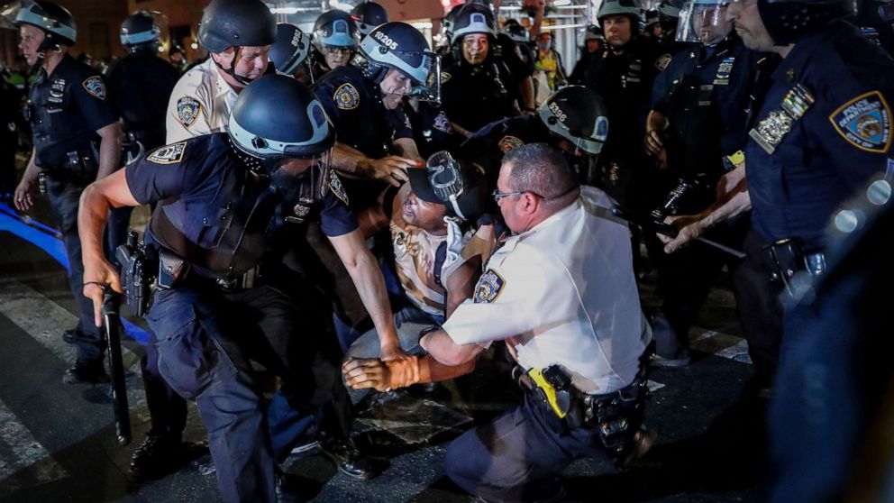 PHOTO: A protester is arrested on Fifth Avenue by NYPD officers during a march, Thursday, June 4, 2020, in the Manhattan borough of New York.