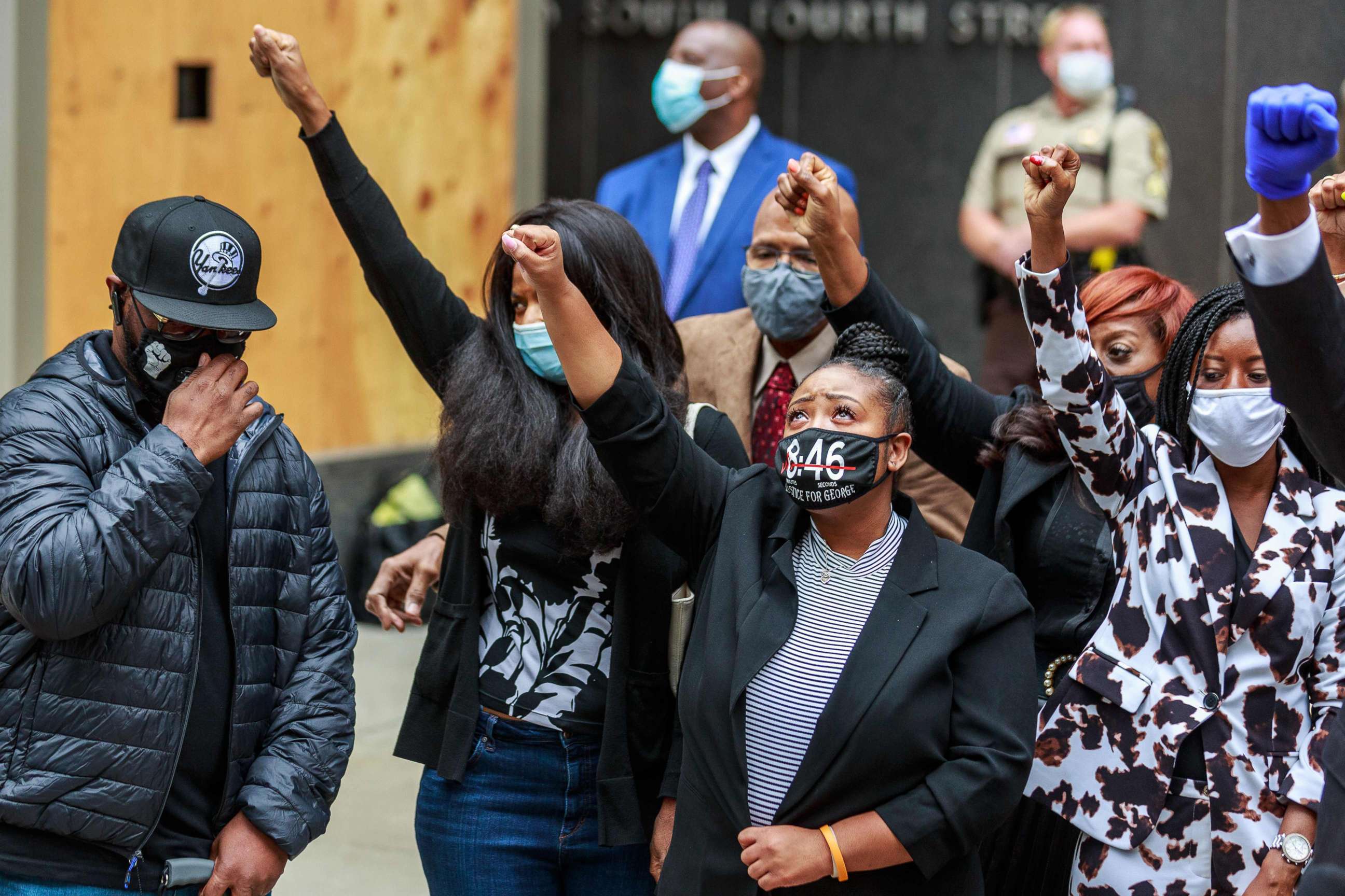 PHOTO: George Floyd's family raise their fists at a press conference outside the family justice center after a court hearing on the murder of George Floyd in Minneapolis, Sept. 11, 2020.