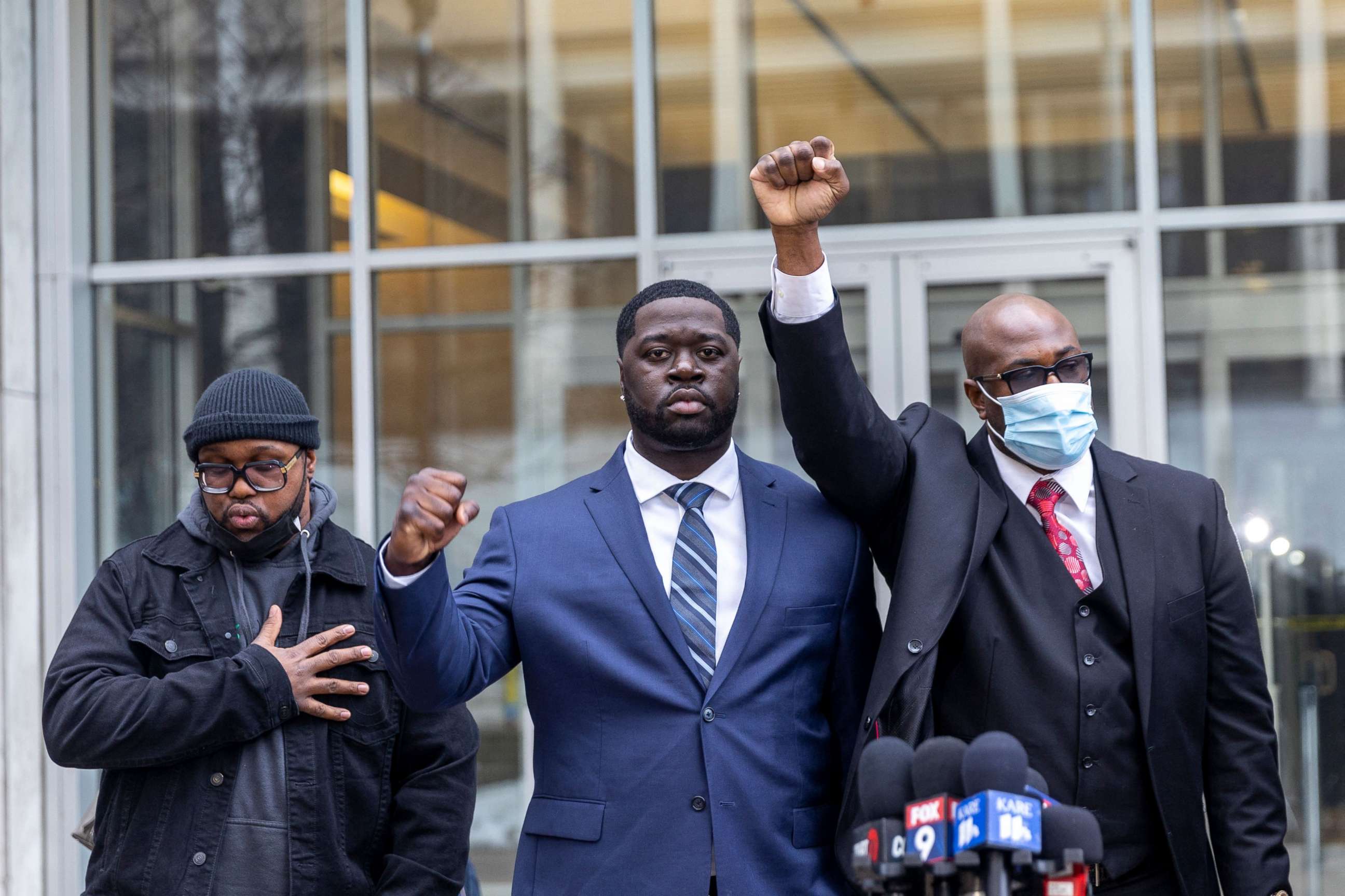 PHOTO: Philonise Floyd, right, and Terrence Floyd, left, George Floyd's brothers, and nephew Brandon Williams, center, attend a press conference outside the US District Court in St Paul, Minn., Dec. 15, 2021.