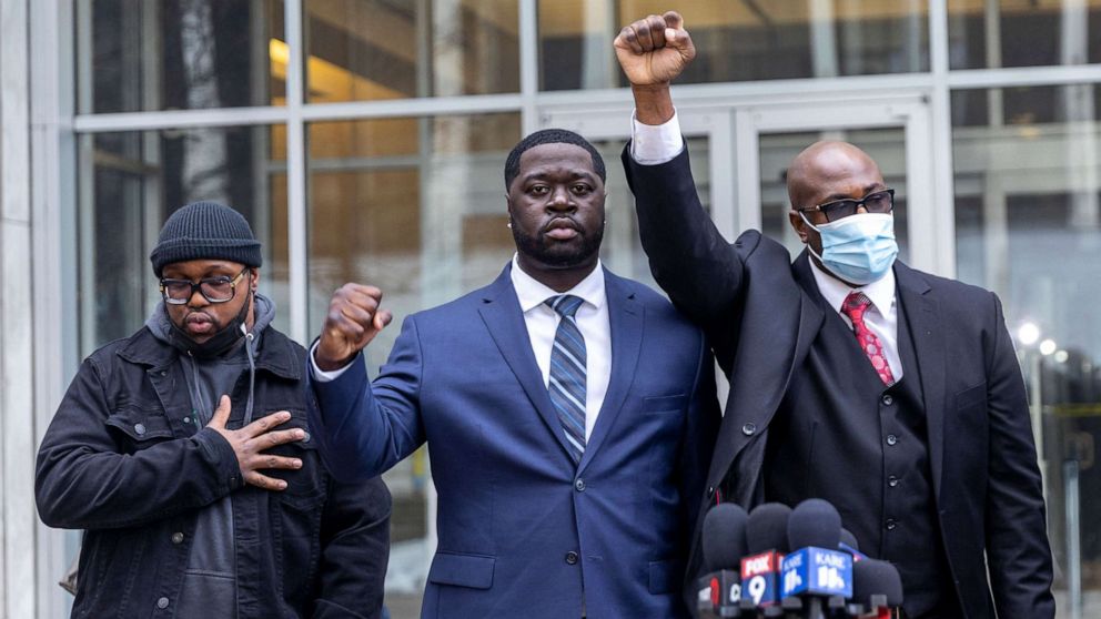 PHOTO: Philonise Floyd, right, and Terrence Floyd, left, George Floyd's brothers, and nephew Brandon Williams, center, attend a press conference outside the US District Court in St Paul, Minn., Dec. 15, 2021.