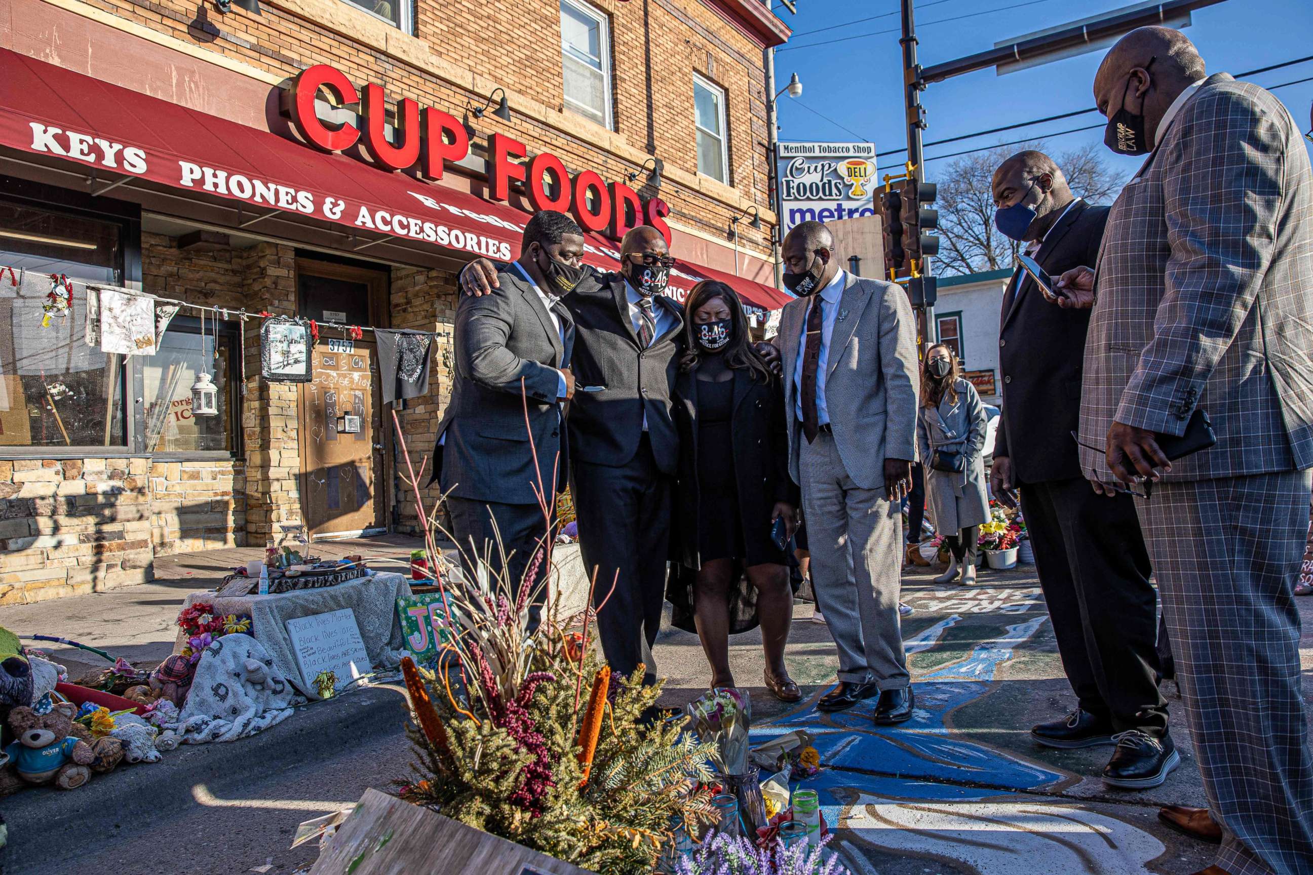 PHOTO: Members of George Floyd's family, including brother Philonise Floyd, and Floyd family lawyer Ben Crump visit a memorial at the site where George Floyd died while being arrested, after attending a press conference on March 12, 2021, in Minneapolis.