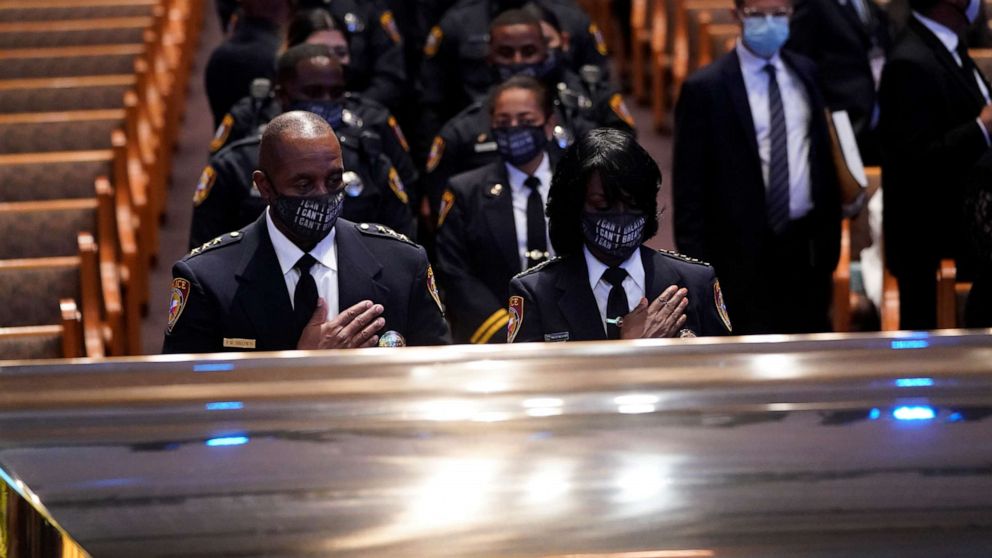 PHOTO: Members of the Texas South University police department pause by the casket of George Floyd during a funeral service at the Fountain of Praise church, in Houston, June 9, 2020.