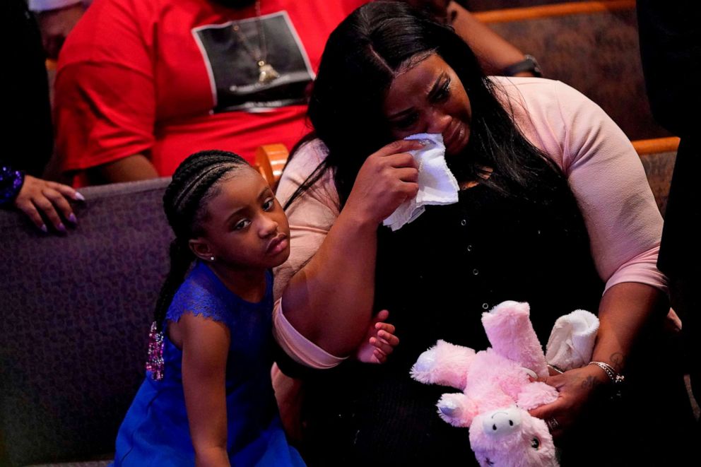 PHOTO: Gianna Floyd, the daughter of George Floyd, sits with Roxie Washington as they attend the funeral service for George Floyd at The Fountain of Praise church, June 9, 2020, in Houston.