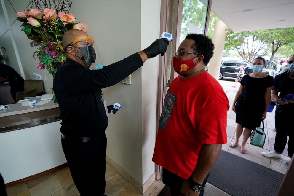 PHOTO: Mourners arrive in the church for a public visitation for George Floyd at the Fountain of Praise church in Houston, June 8, 2020.