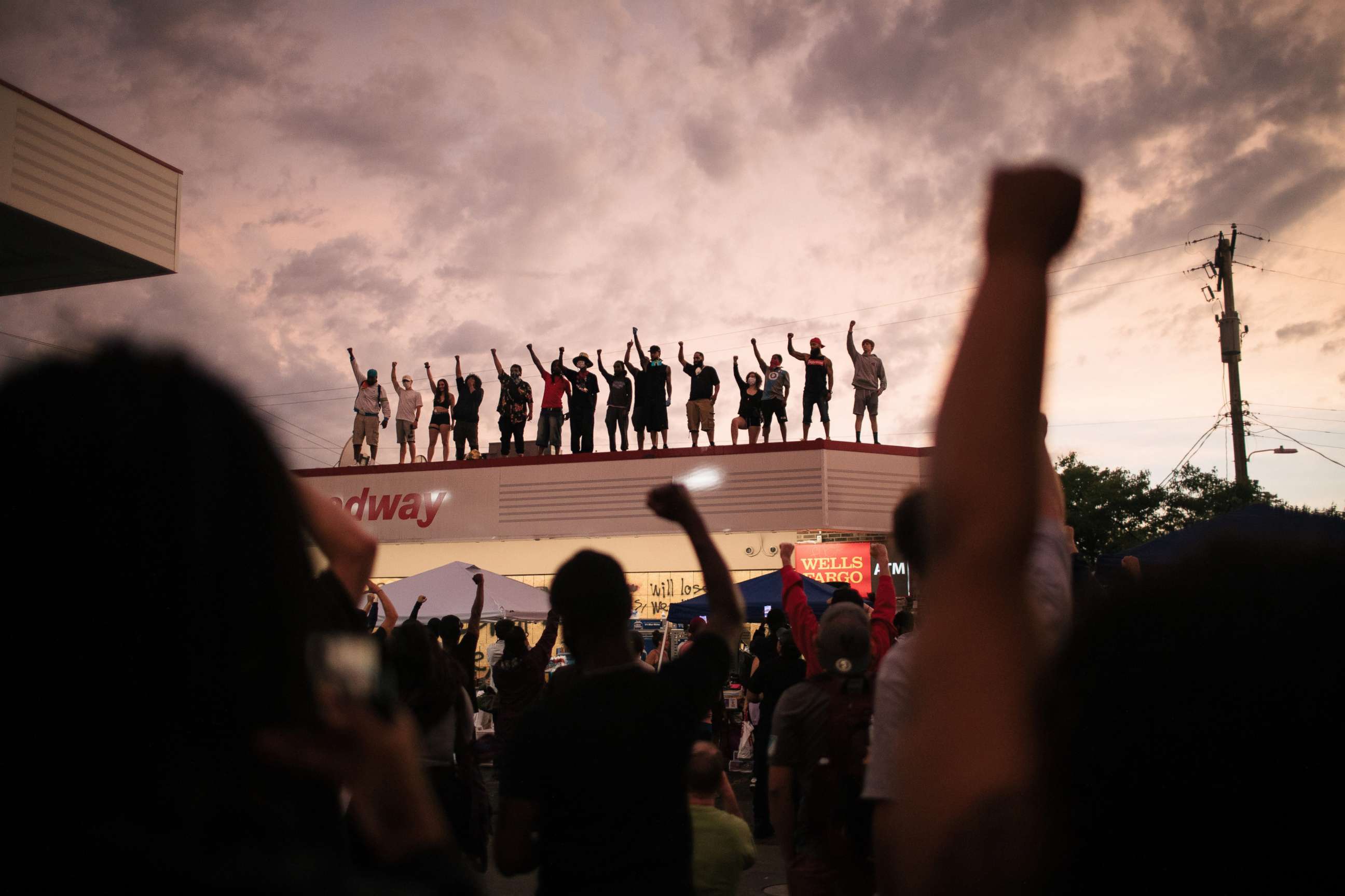 PHOTO: Protesters gather, Tuesday, June 2, 2020, at the makeshift memorial where George Floyd died in Minneapolis.