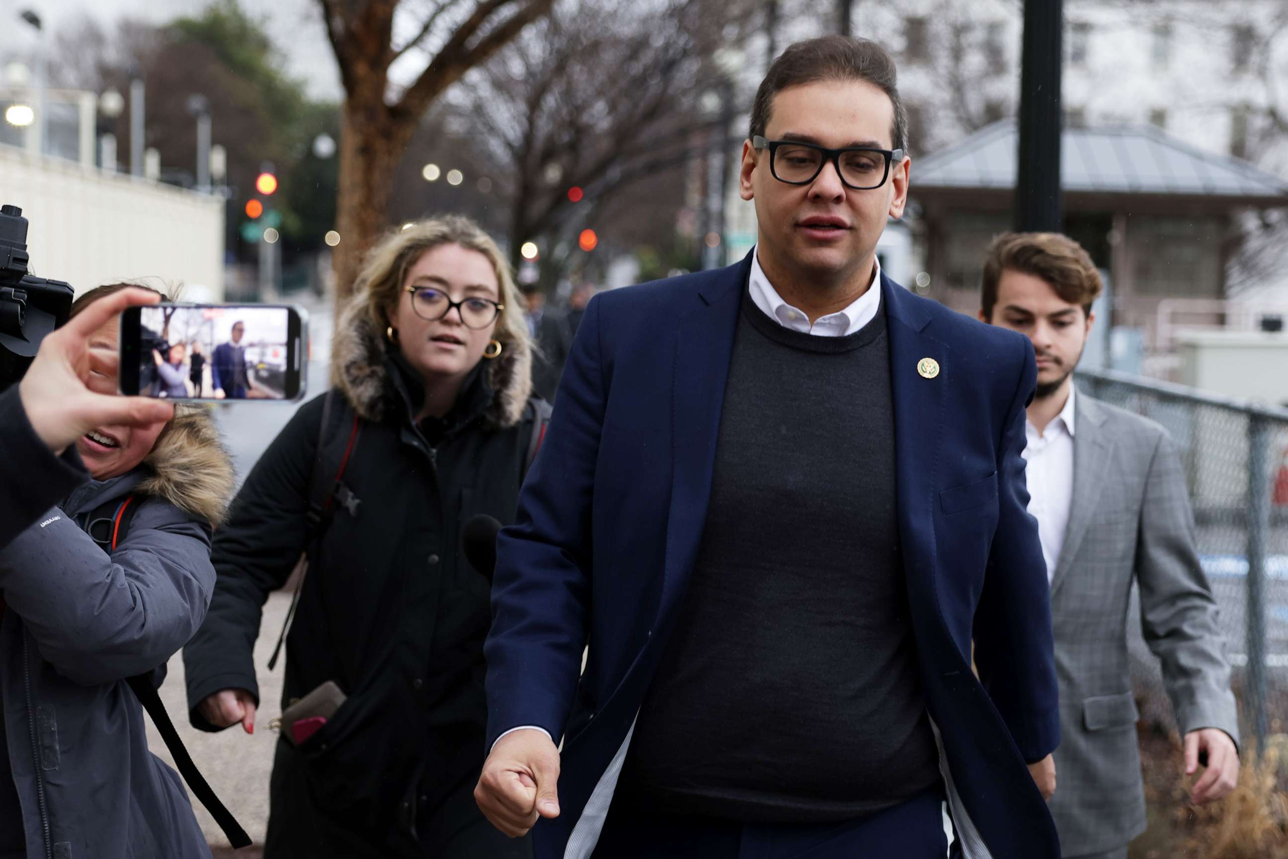 PHOTO: Rep. George Santos leaves the Capitol Hill Club as members of the press follow him on Jan. 31, 2023 in Washington, DC.
