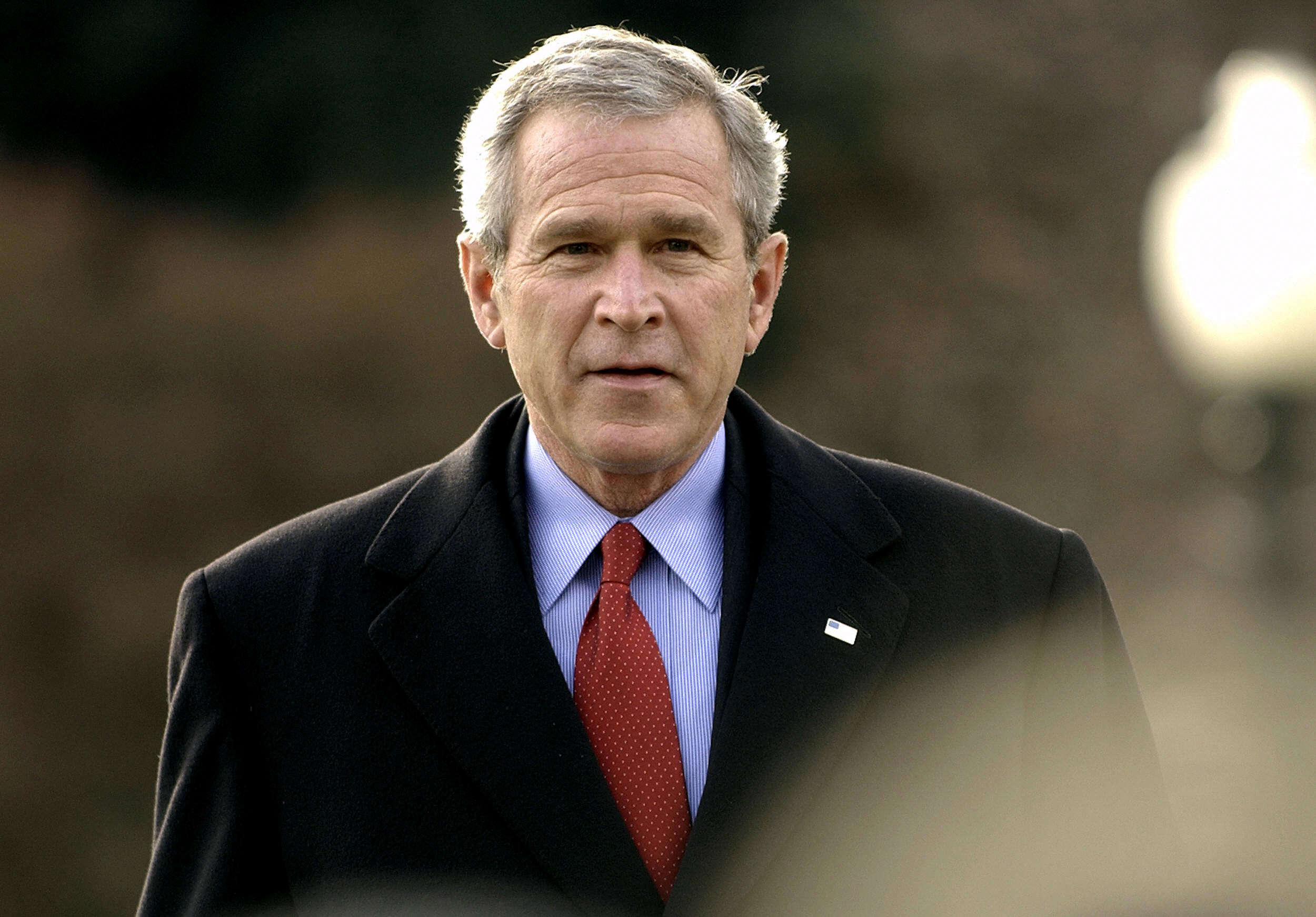 PHOTO: President George W. Bush walks towards microphones to speak to the press, Dec. 22, 2005 at the White House.