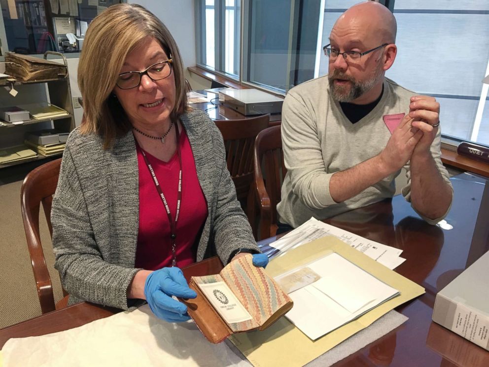 PHOTO: India Spartz, left, head of special collections and archives at Union College, and librarian John Myers look at an old almanac from the college archives in Schenectady, N.Y., Feb. 14, 2018.