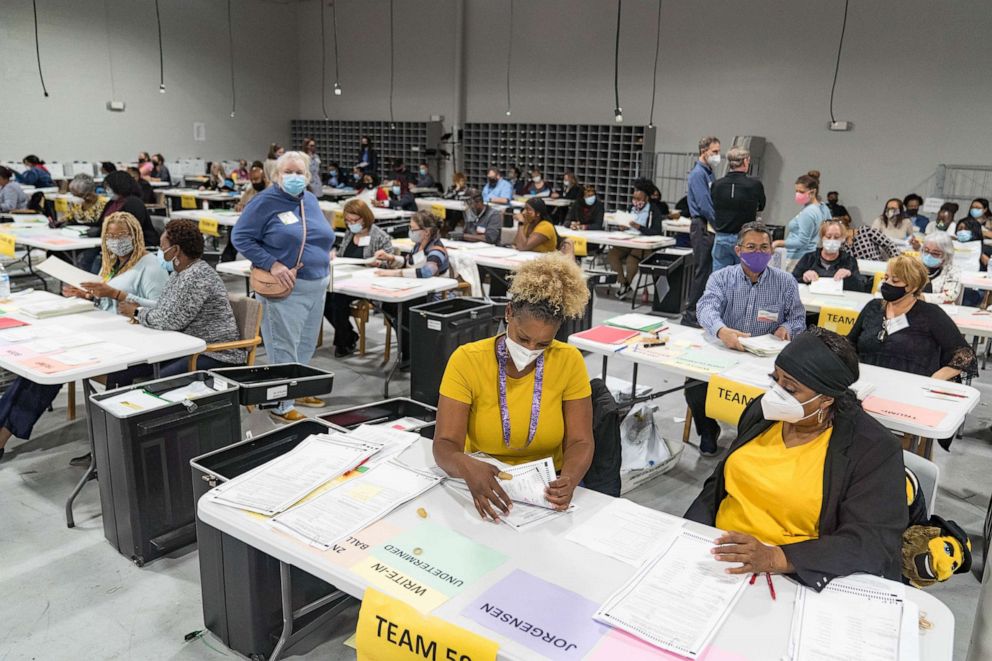 PHOTO: Gwinnett County election workers handle ballots as part of the recount for the 2020 presidential election at the Beauty P. Baldwin Voter Registrations and Elections Building, Nov. 16, 2020 in Lawrenceville, Ga.
