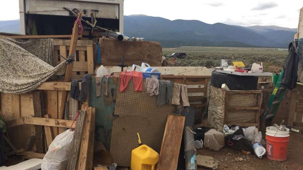Eleven children were held with little food or water in a makeshift compound in Amalia, N.M., for an unknown period of time before police raided the location on Friday, Aug. 3, 2018.