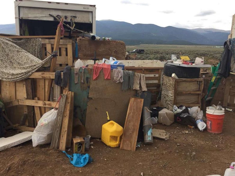 Eleven children were held with little food or water in a makeshift compound in Amalia, N.M., for an unknown period of time before police raided the location on Friday, Aug. 3, 2018.