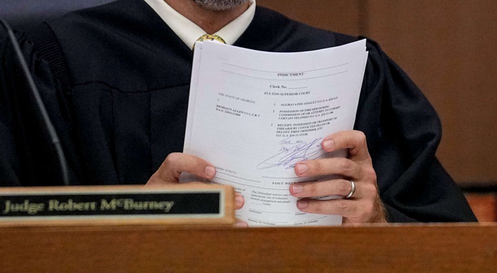 PHOTO: Fulton County Superior Court Judge Robert McBurney holds documents in his courtroom, Aug. 14, 2023, in Atlanta.