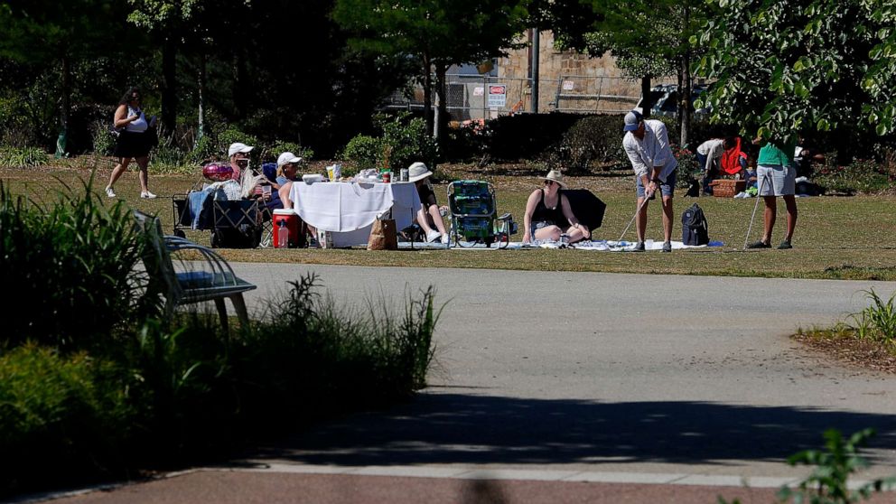 PHOTO: Park goers enjoy a picnic at Historic Fourth Ward Park, May 10, 2020, in Atlanta.