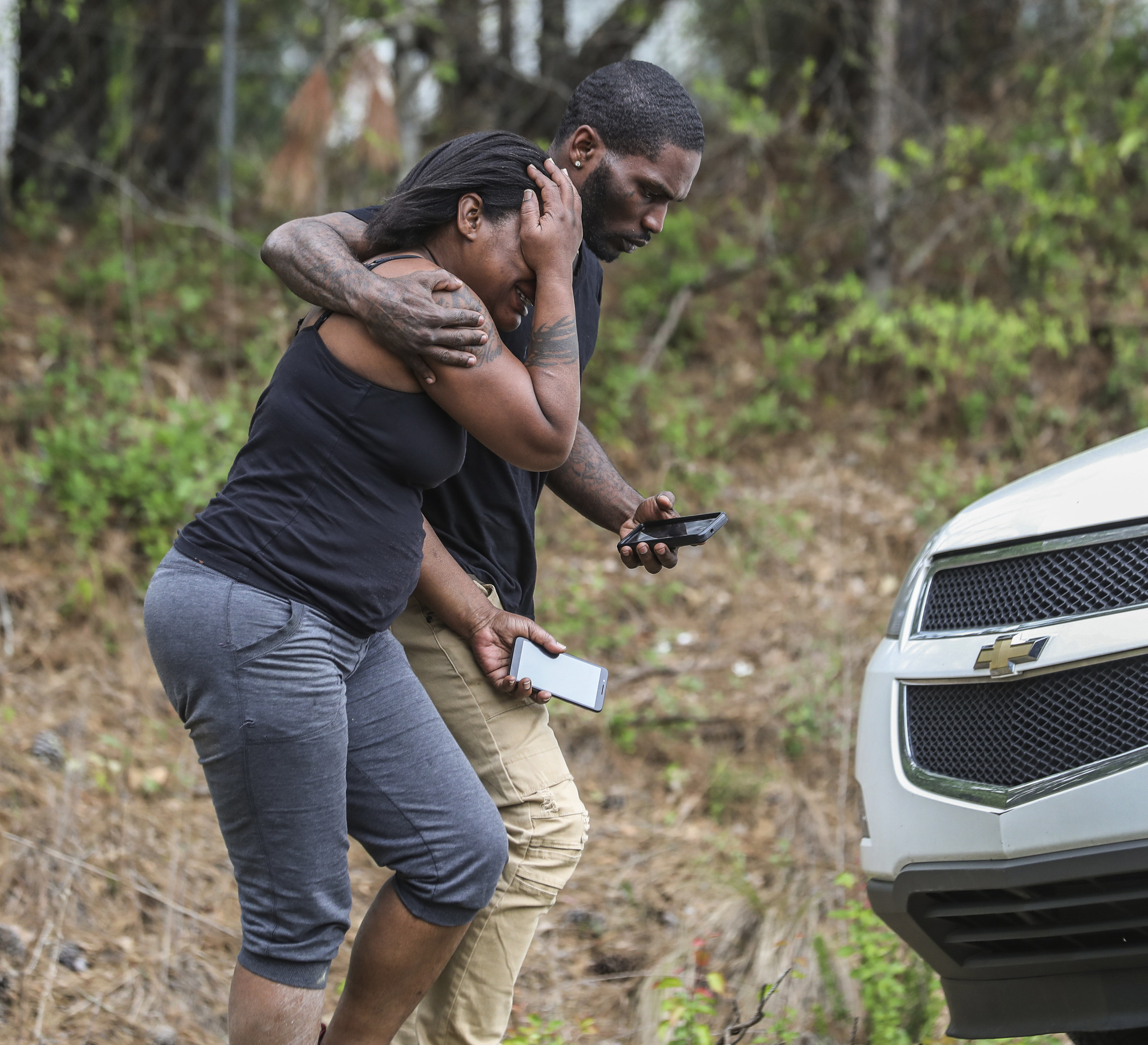 PHOTO: A couple of people leave a scene where a gunman reportedly shot a few Henry County police officers in Stockbridge, Ga., Thursday, April 4, 2019.