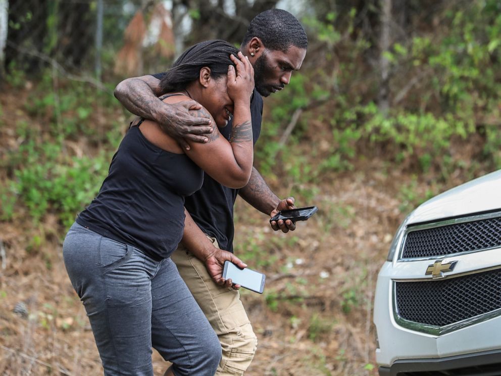 PHOTO: A couple of people leave a scene where a gunman reportedly shot a few Henry County police officers in Stockbridge, Ga., Thursday, April 4, 2019.