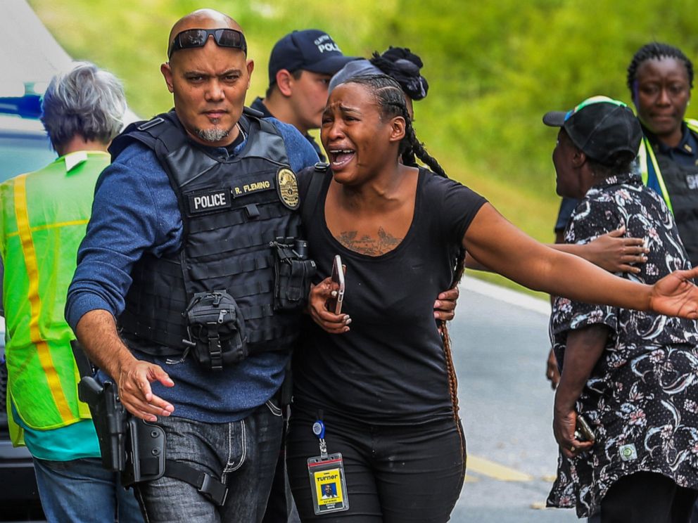 PHOTO: A woman believed to be related to ones involved in a hostage situation reacts as law enforcement on the scene tried to console them in Stockbridge, Ga., Thursday, April 4, 2019.