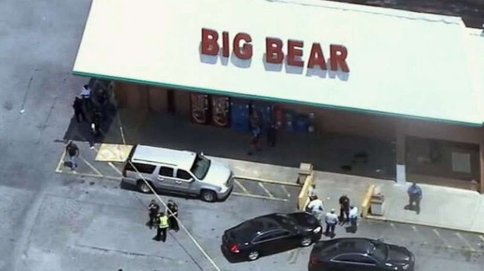 PHOTO: Police respond to a scene where three people were shot at a Big Bear store after a dispute over mask wearing in Dekalb County, Ga., June 14, 2021.