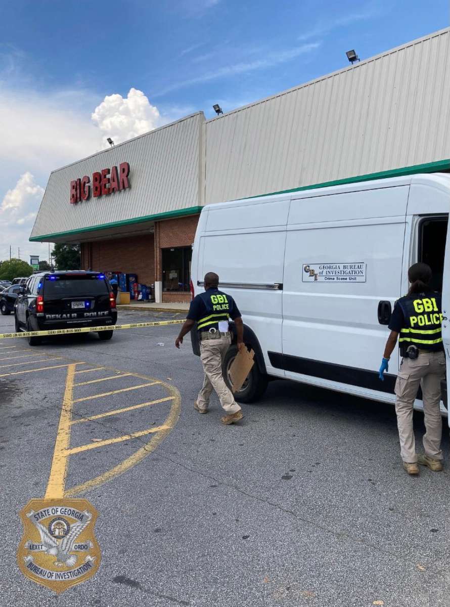 PHOTO: Members of law enforcement respond to a scene where three people were shot at a Big Bear store after a dispute over mask wearing in Dekalb County, Ga., June 14, 2021.