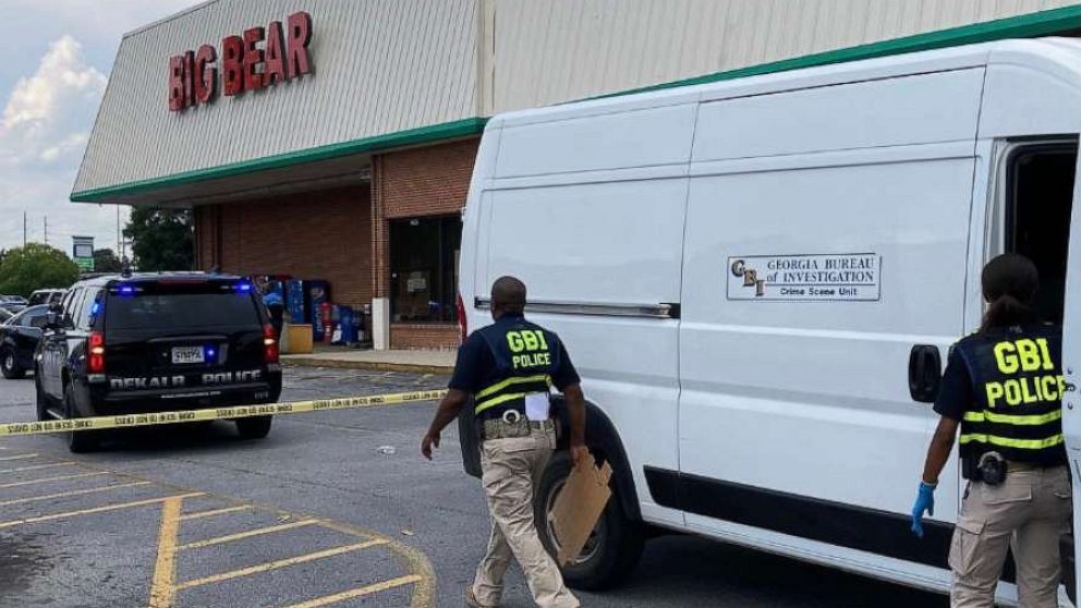 PHOTO: Members of law enforcement respond to a scene where three people were shot at a Big Bear store after a dispute over mask wearing in Dekalb County, Ga., June 14, 2021.