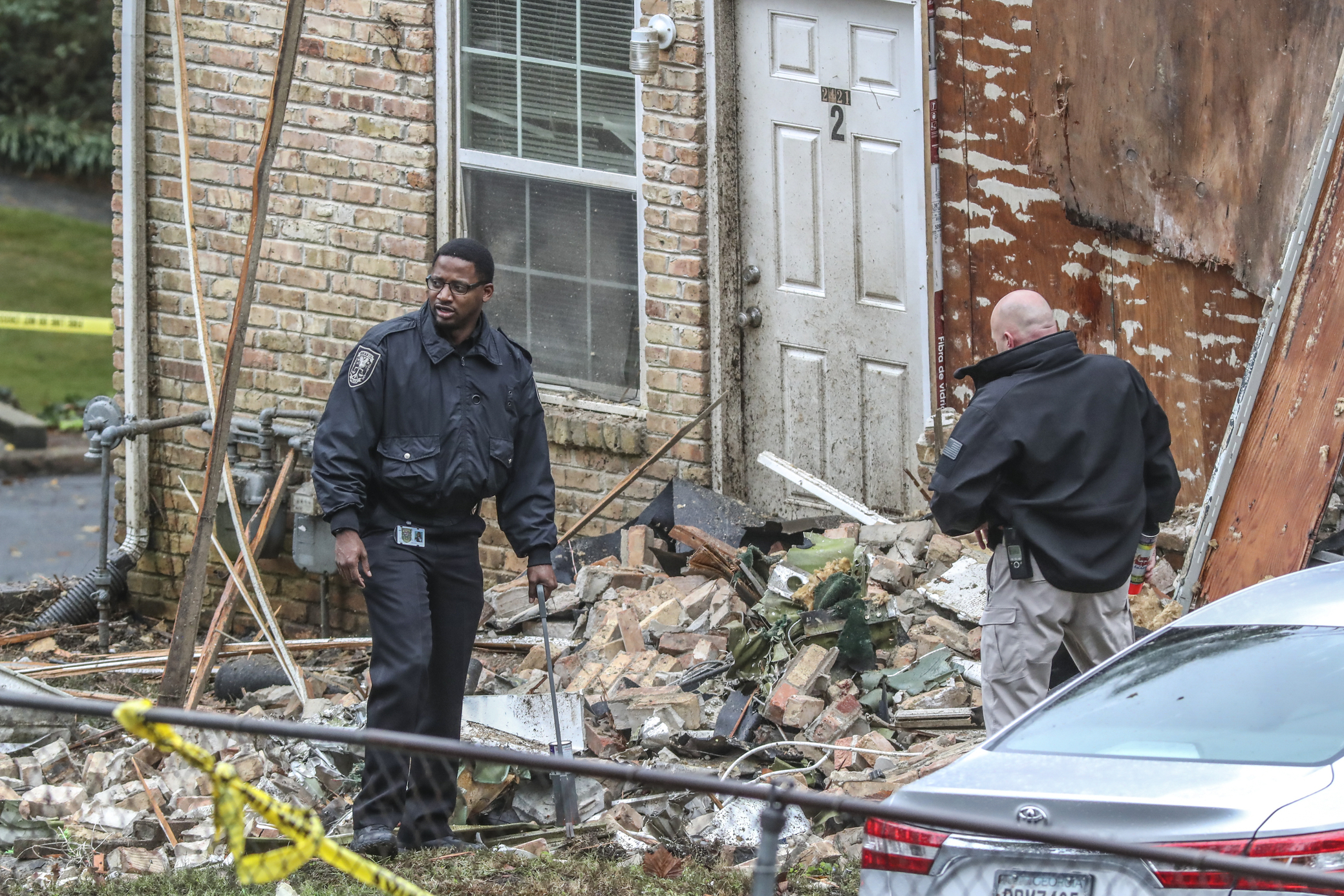 PHOTO: Officials look at the scene where an airplane crashed into an apartment complex, Oct. 30, 2019, in Atlanta.