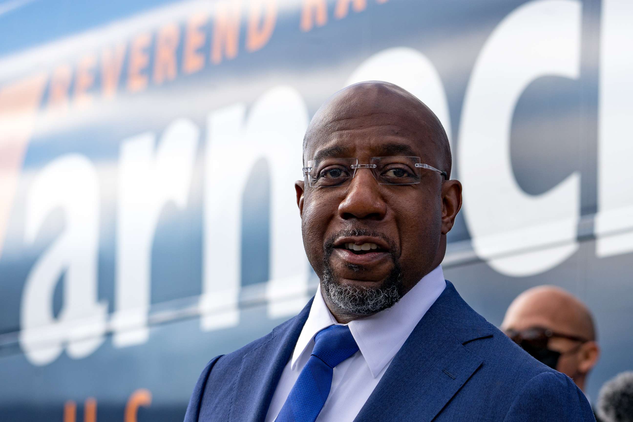 PHOTO: Democratic Senate candidate Raphael Warnock appears at a small rally with young campaign volunteers on election day in Georgia's U.S. Senate runoff election, in Marietta, Ga., Jan. 5, 2021.