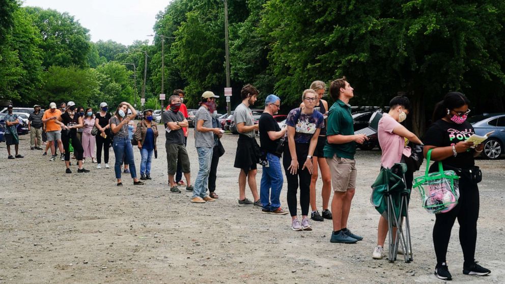 PHOTO: People wait in line to vote in Georgias Primary Election, June 9, 2020 in Atlanta.
