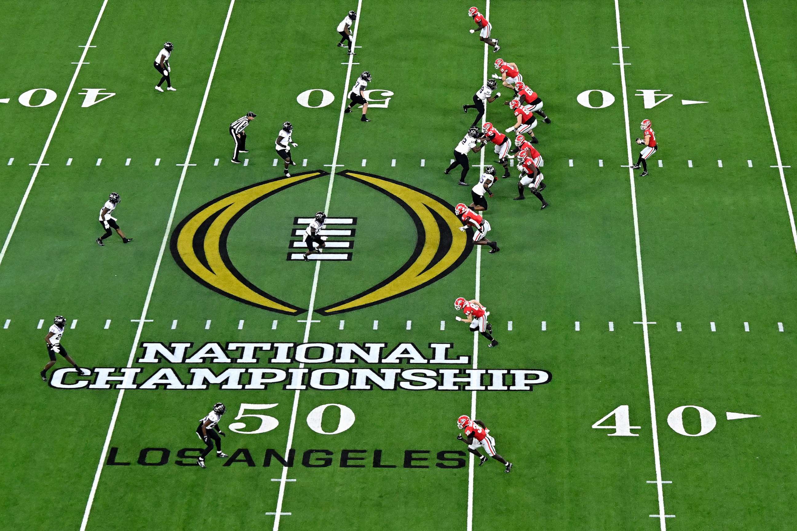 PHOTO: INGLEWOOD, CALIFORNIA - JANUARY 09: A view of the National Championship logo on the field as the Georgia Bulldogs run a play against the TCU Horned Frogs in the College Football Playoff National Championship game at SoFi Stadium on Jan. 9, 2023.