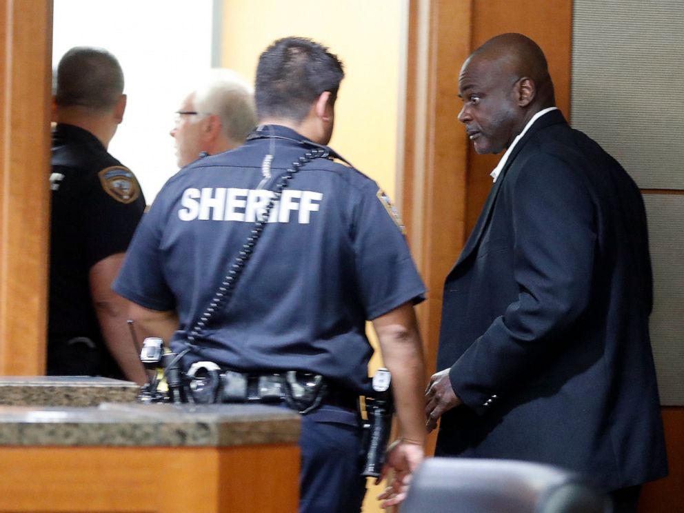 PHOTO: Former Houston police officers Gerald Goines walks toward deputies who were prepared to place him into custody along with Steven Bryant, after they turned themselves in at the Civil Courthouse, Friday, Aug. 23, 2019, in Houston.