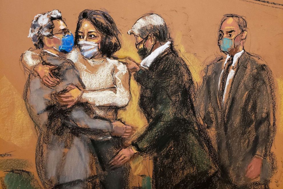 PHOTO: Ghislaine Maxwell embraces her defense lawyers after entering the courtroom for the start of her trial on charges of sex trafficking, in a courtroom sketch in New York City, Nov. 29, 2021. 