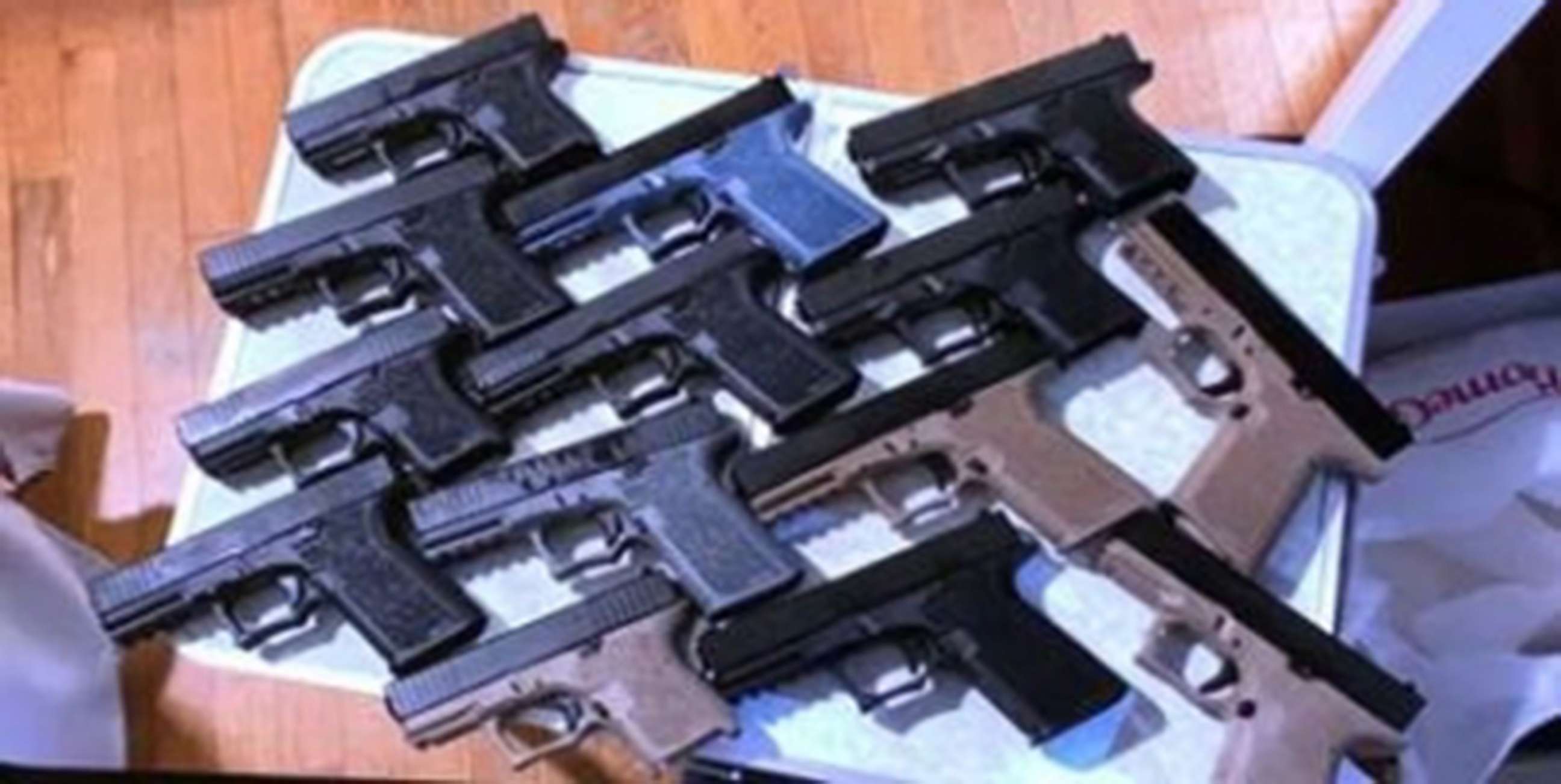 PHOTO: Evidence photos released by the Department of Justice show some of the 45 ghost guns  seized from the home of Robert Alcantara, as well as photographs of firearms Alcantara allegedly intended to sell to buyers, Providence, R.I., Jan. 6, 2022.